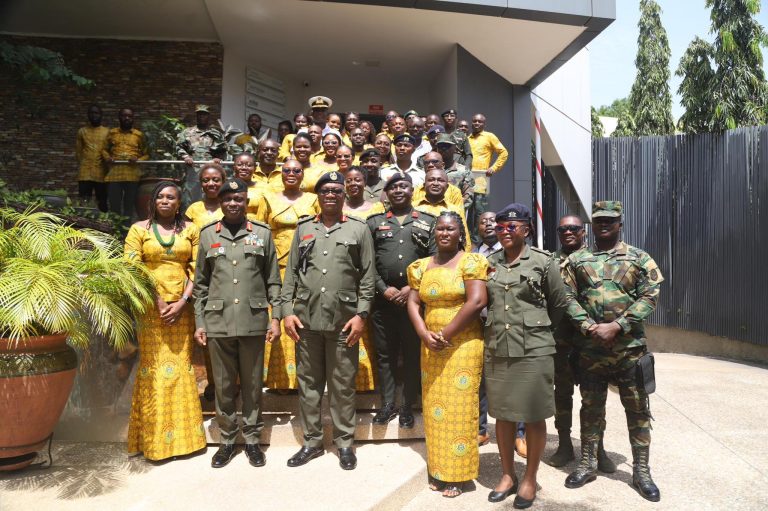 group picture with outgoing and incoming commissioner