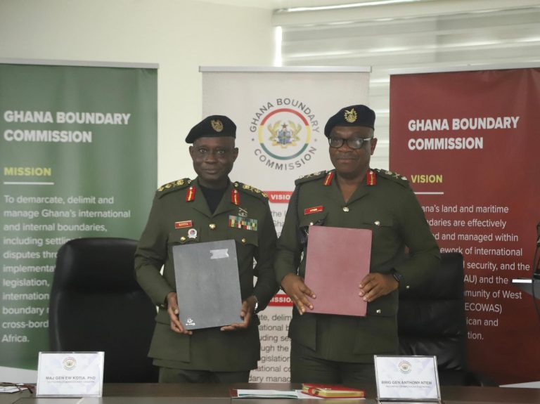 outgoing and incoming commissioner with handing over