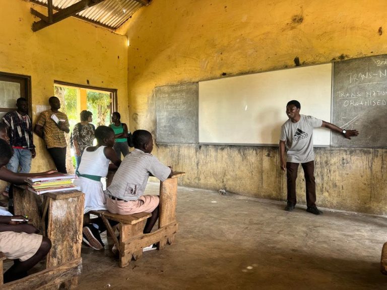 Sensitisation exercise in Saru and Sawla-Tuna-Kalba District - 7th October 2024 research member with children at saru 24