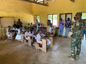 commander ocloo with school children in saru sensitization 2024